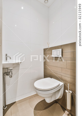 Interior of small clean toilet in miniature style 82115949