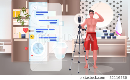 man beauty blogger recording online video with camera on tripod blogging concept bathroom interior man beauty blogger recording online video with camera on tripod blogging concept bathroom interior 82116386