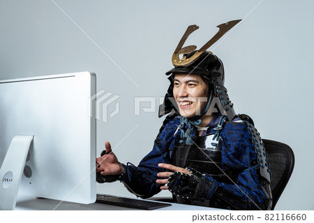 Samurai attending a video conference on a computer 82116660