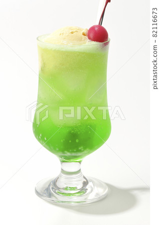 Photographed melon cream soda with cherries on a white background 82116673