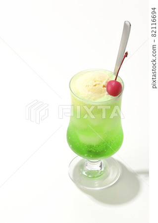 Photographed melon cream soda with cherries on a white background 82116694