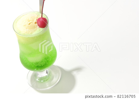 Photographed melon cream soda with cherries on a white background 82116705