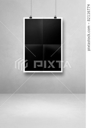 Black folded poster hanging on a clean wall with clips 82116774