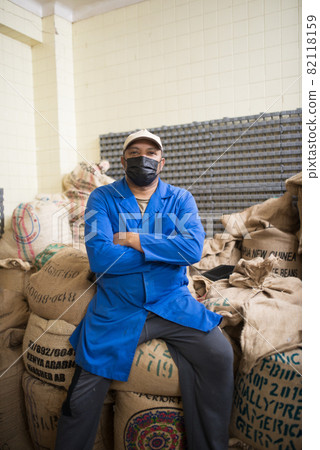 Portrait of coffee roaster at storehouse Portrait of coffee roaster at storehouse 82118159