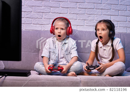children playing video game with game console 82118196