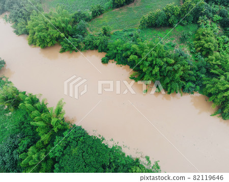 Aerial view river flood forest nature woodland area green tree, Top view river lagoon pond with water flood from above, Bird eye view landscape jungles lake flowing wild water after the rain Aerial view river flood forest nature woodland area green tree, Top view river lagoon pond with water flood from above, Bird eye view landscape jungles lake flowing wild water after the rain 82119646