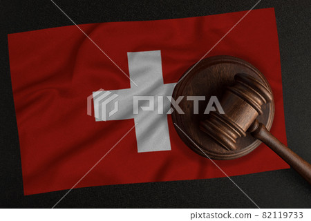 Judges hammer and the flag of Switzerland. Law and Justice. Constitutional law 82119733