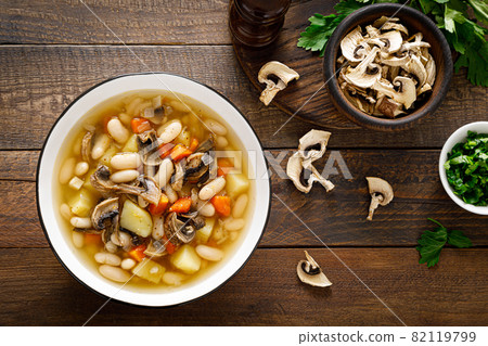 Mushroom soup with kidney bean, potato and carrot. Top view, copy space Mushroom soup with kidney bean, potato and carrot. Top view, copy space 82119799