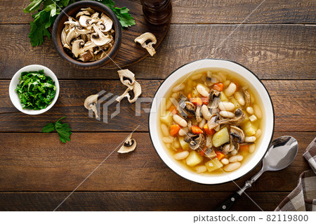 Mushroom soup with kidney bean, potato and carrot. Top view, copy space Mushroom soup with kidney bean, potato and carrot. Top view, copy space 82119800