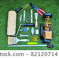 Home renovation and construction concept with work tools in house shape on the grass 82120714