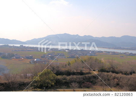 The mouth of the Yoshii River, Kojima Bay, and Kojima Peninsula in early spring as seen from Kanzaki Ryokuchi, Higashi-ku, Okayama City, Okayama Prefecture The mouth of the Yoshii River, Kojima Bay, and Kojima Peninsula in early spring as seen from Kanzaki Ryokuchi, Higashi-ku, Okayama City, Okayama Prefecture 82120863