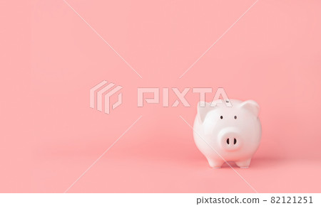 Money saving and investment concept. Piggy bank on pink background with copy space Money saving and investment concept. Piggy bank on pink background with copy space 82121251