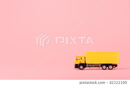 Logistics, and delivery service - Cargo truck and on Pink background. Shopping service on The online web and offers home delivery. with copy space Logistics, and delivery service - Cargo truck and on Pink background. Shopping service on The online web and offers home delivery. with copy space 82122100