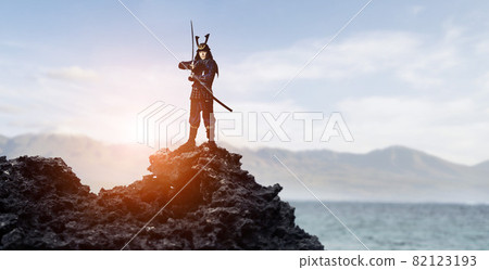 Samurai standing on a rocky mountain 82123193