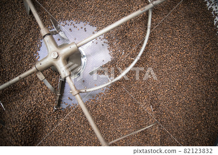 Close-up of coffee beans in modern roasting machine Close-up of coffee beans in modern roasting machine 82123832