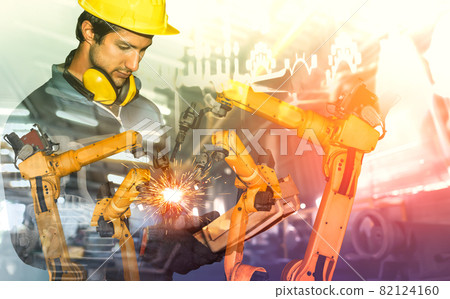 Mechanized industry robot arm and factory worker double exposure 82124160