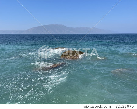 Rocky beach and crystal turquoise water of Ionian Sea in Albania. 82125070