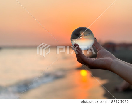 Beautiful scenic view through lens of crystal ball at summer sunset. Beautiful scenic view through lens of crystal ball at summer sunset. 82125082