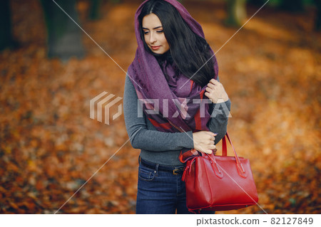 brunette girl relaxing at the park 82127849