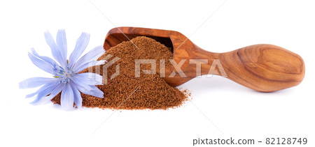 Chicory powder and flower in wooden scoop, isolated on white background. Cichorium intybus. Chicory powder and flower in wooden scoop, isolated on white background. Cichorium intybus. 82128749