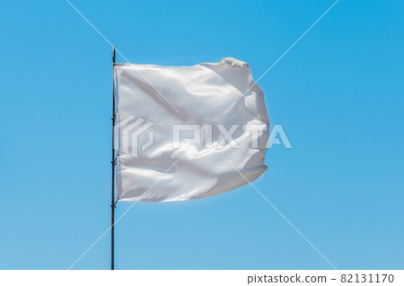 White flag sign and symbol of goodness and truce on blue sky background 82131170