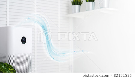 air purifier a living room, air cleaner removing fine dust in house. protect PM 2.5 dust and air pollution concept 82131555