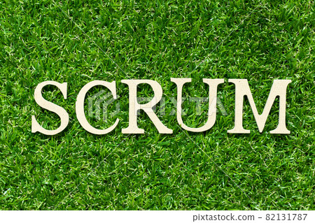 Wood letter in word scrum on green grass background Wood letter in word scrum on green grass background 82131787