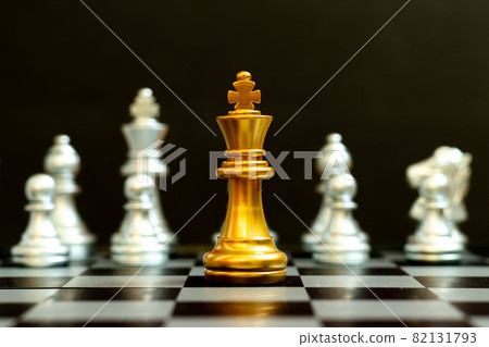 Gold king in chess game face with the another silver team on black background (Concept for company strategy, business victory or decision) Gold king in chess game face with the another silver team on black background (Concept for company strategy, business victory or decision) 82131793