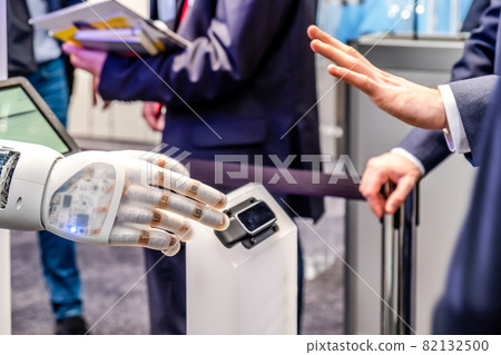 Human hand and robot's as a symbol of connection between people and artificial intelligence technology Human hand and robot's as a symbol of connection between people and artificial intelligence technology 82132500