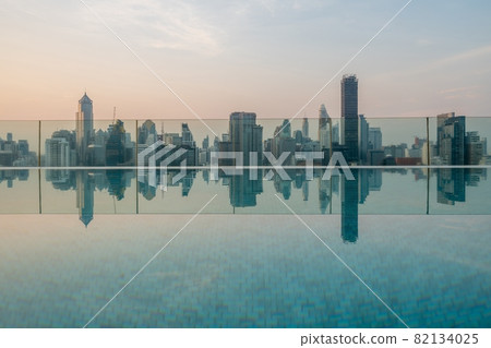 Cityscape and high-rise buildings in metropolis city with water reflection 82134025