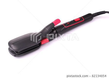 Curling iron on a white background. 82134854