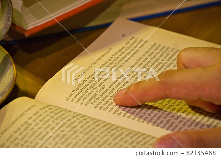 A man reading a book A man reading a book 82135468