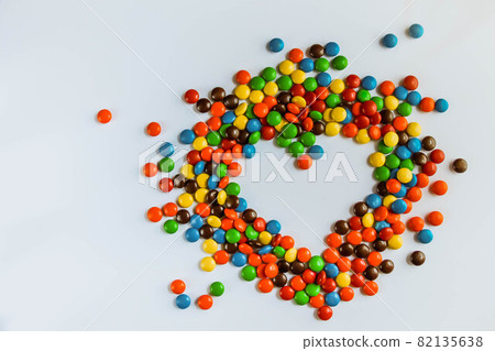 heart made of candy on a white background. the heart of the bright jelly beans. a sweet gift for Valentine's day 82135638