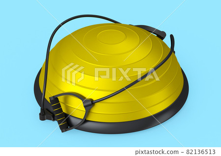 Yellow fitness ball with hand expander isolated blue background Yellow fitness ball with hand expander isolated blue background 82136513