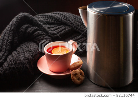 Cup of tea and electrical teapot Cup of tea and electrical teapot 82136744