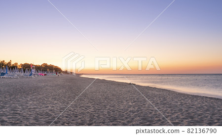 Panorama of adriatic sea and beach with umbrella at sunrise 82136790
