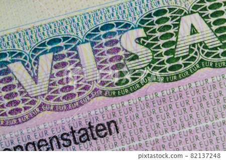 Schengen European visa stamp in the passport. Clouse-Up. Fragment of Schengen visa in the passport Schengen European visa stamp in the passport. Clouse-Up. Fragment of Schengen visa in the passport 82137248