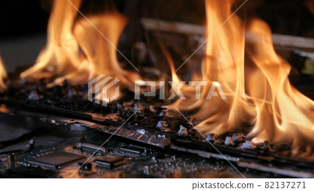 Burning laptop computer electronics closeup 82137271