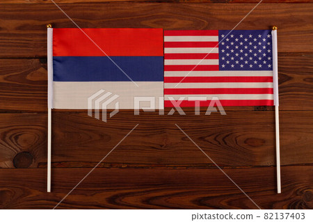 The US and the Russian flag face each other. Kiss of friendship. USA vs Russia. Meeting between the presidents of the United States and Russia. Tensions in relations between the countries are growing The US and the Russian flag face each other. Kiss of friendship. USA vs Russia. Meeting between the presidents of the United States and Russia. Tensions in relations between the countries are growing 82137403