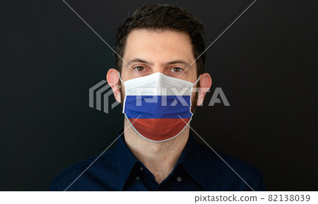 Man wearing Russian flag protective medical face mask. 82138039