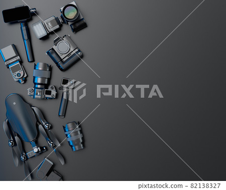 Top view of designer workspace and photography gear on black table background 82138327