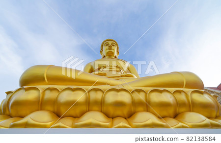 The Giant Golden Buddha in Wat Paknam Phasi Charoen Temple in Phasi Charoen district at noon, Bangkok urban city town, Thailand. Tourist attraction landmark. 82138584