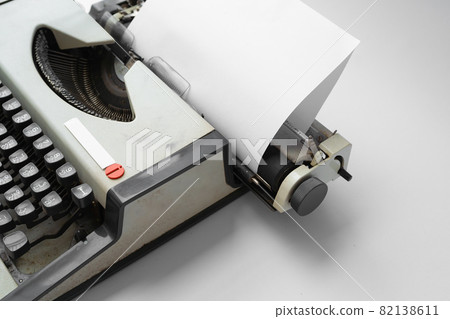 Old Thai traditional typewriter. Classic vintage antique manual typing machine isolated on white background. 19th century item. 82138611
