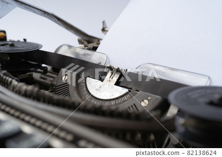 Old Thai traditional typewriter. Classic vintage antique manual typing machine isolated on white background. 19th century item. 82138624