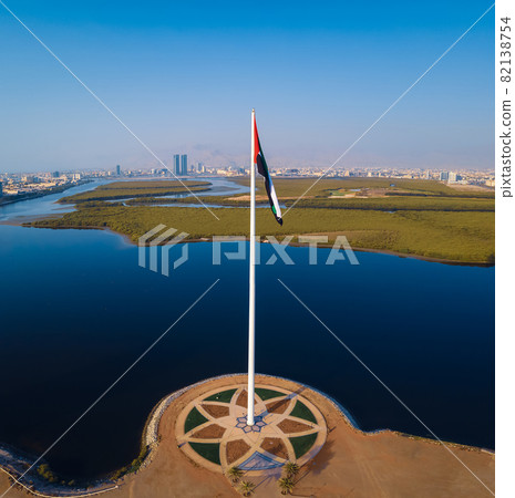 UAE flag and Ras al Khaimah emirate in the north United Arab Emirates aerial skyline landmark view 82138754