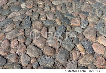 Old cobblestone pavement in the ancient European city Old cobblestone pavement in the ancient European city 82139318