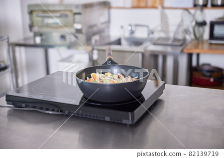 Meat and vegetables fried in a frying pan Meat and vegetables fried in a frying pan 82139719