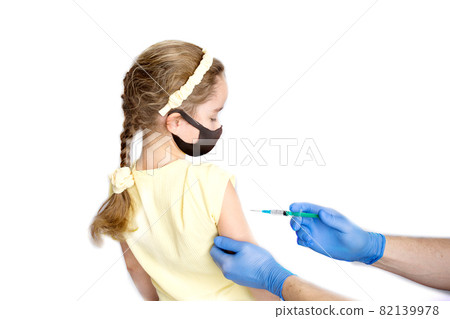 A nurse is giving vaccinations to patients with a syringe. White background. Close-up shot of injection against covid19. A nurse is giving vaccinations to patients with a syringe. White background. Close-up shot of injection against covid19. 82139978
