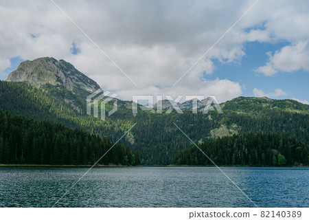 Black Lake Crno jezero , northern Montenegro. It is a glacial lakeon the Mount Durmitor, on an altitude of 1,416 m. Black lake in Durmitor national park in Montenegro, Europe. Beauty world. Black Lake Crno jezero , northern Montenegro. It is a glacial lakeon the Mount Durmitor, on an altitude of 1,416 m. Black lake in Durmitor national park in Montenegro, Europe. Beauty world. 82140389