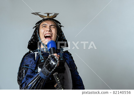 Samurai karaoke screaming with a microphone Samurai karaoke screaming with a microphone 82140556